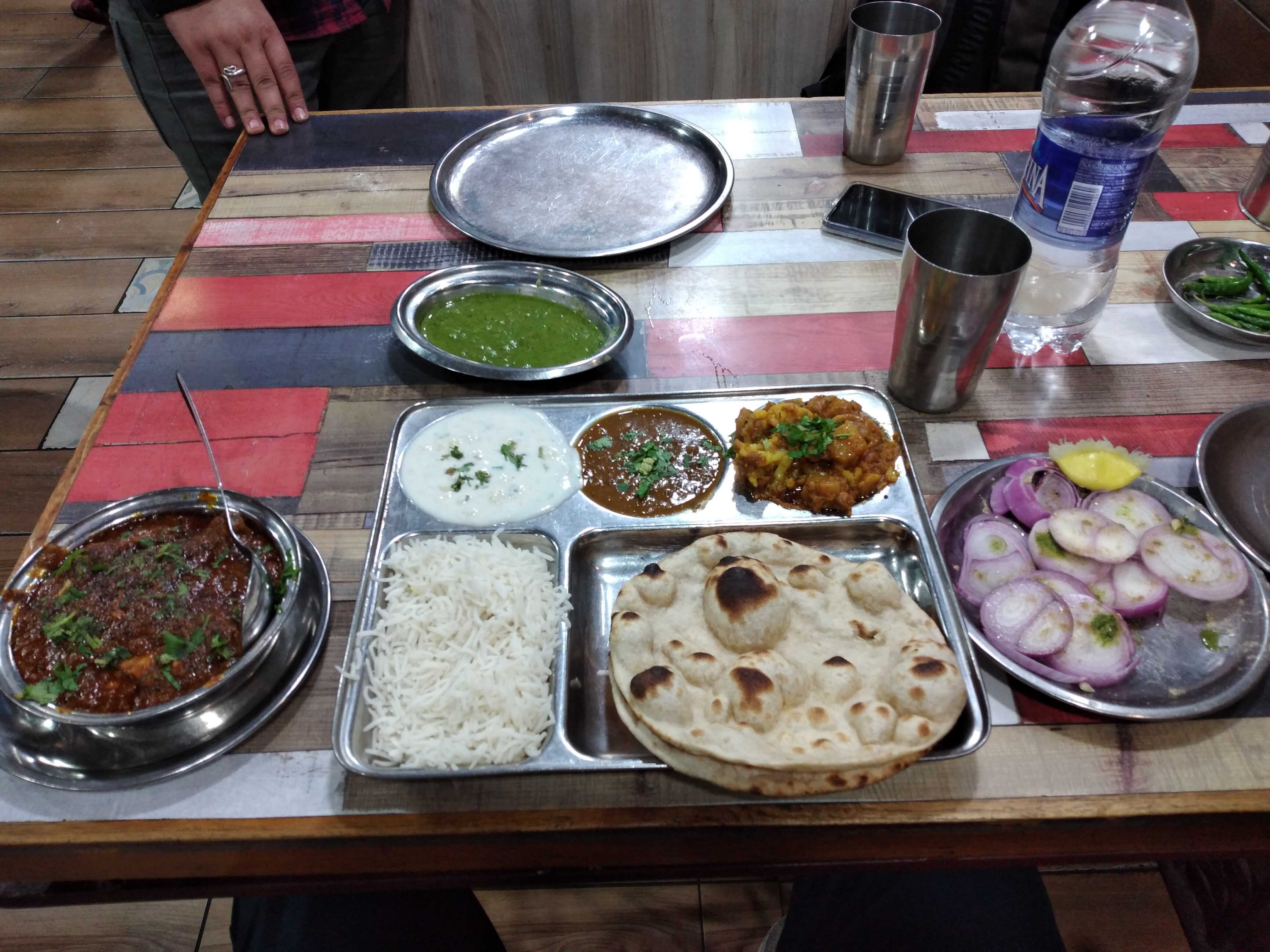 Indian food serves in it's traditional trays