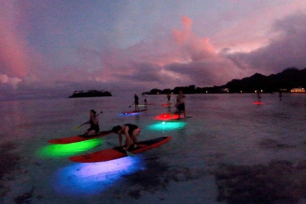 Go paddle boarding at night