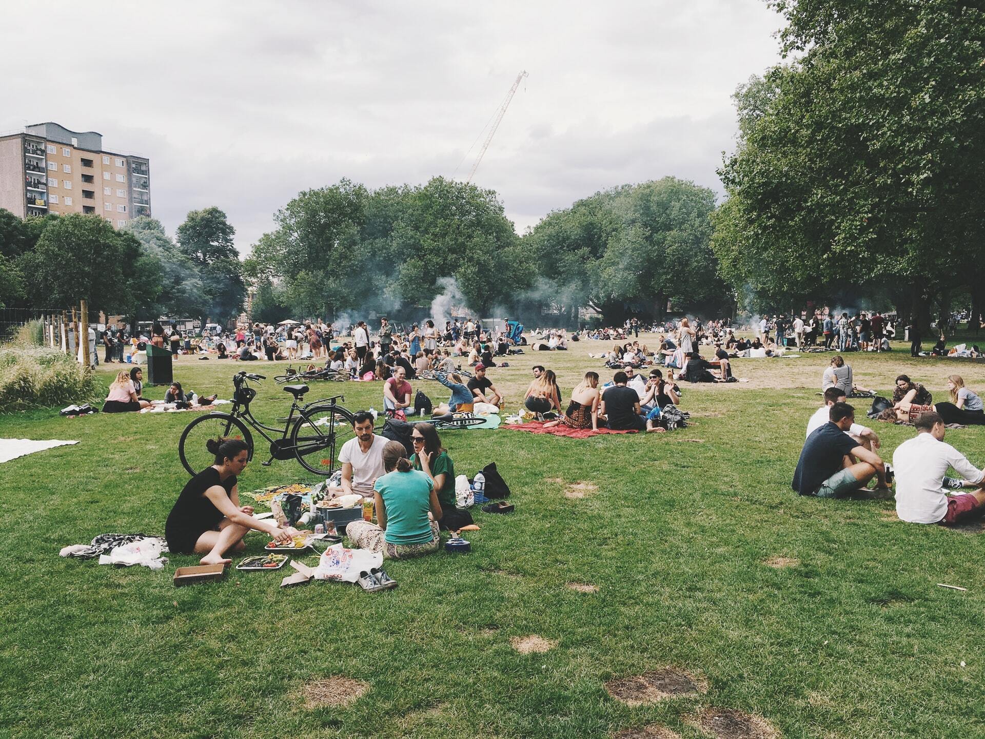 People gather in a London park.