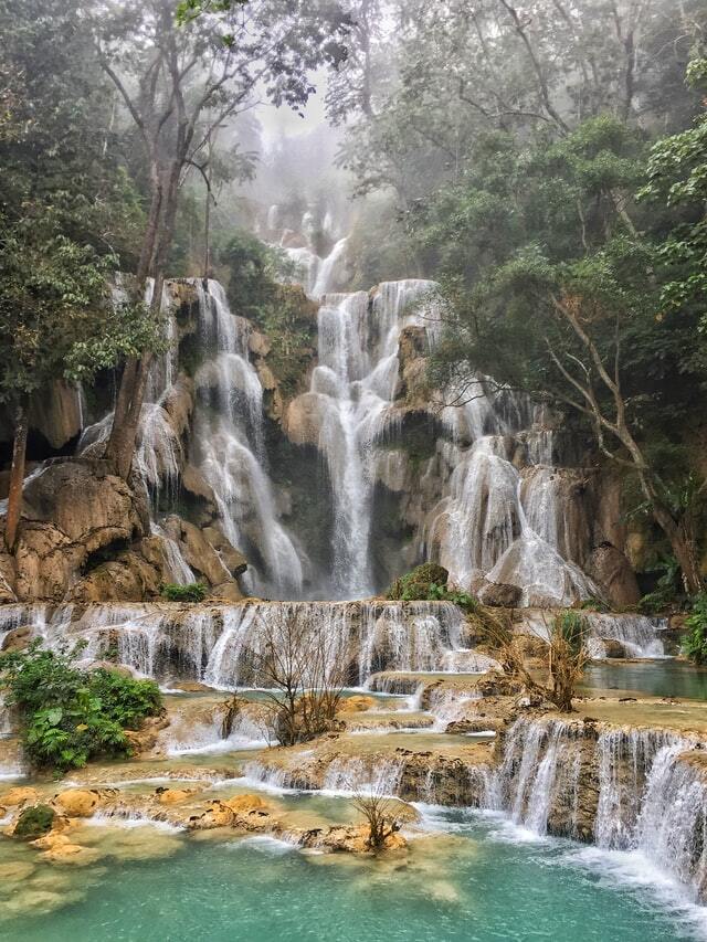 Pak Ou Caves, Whisky Village and Kuang Si Falls by van and boat